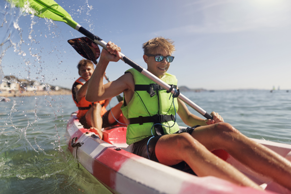 Two people in a kayak on a sunny day