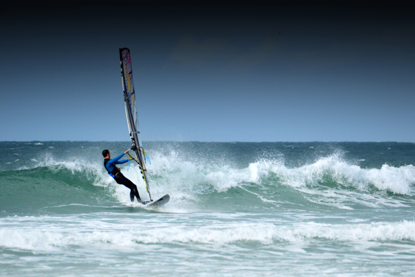 wind surfer on boat at sea